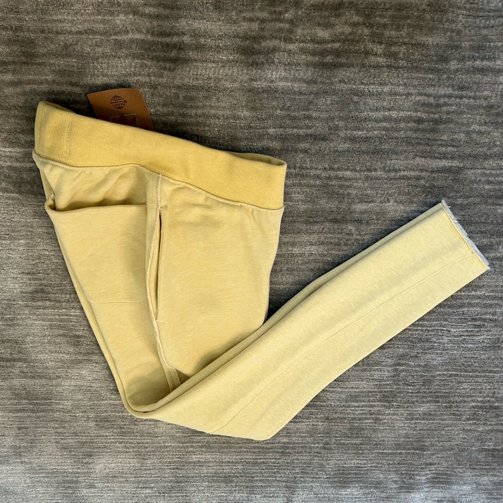 Champion reverse weave men’s slim jogger fleece pant in pale yellow size XS